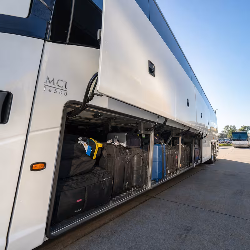 Party bus interior with wraparound leather seating and LED lighting in Frederick
