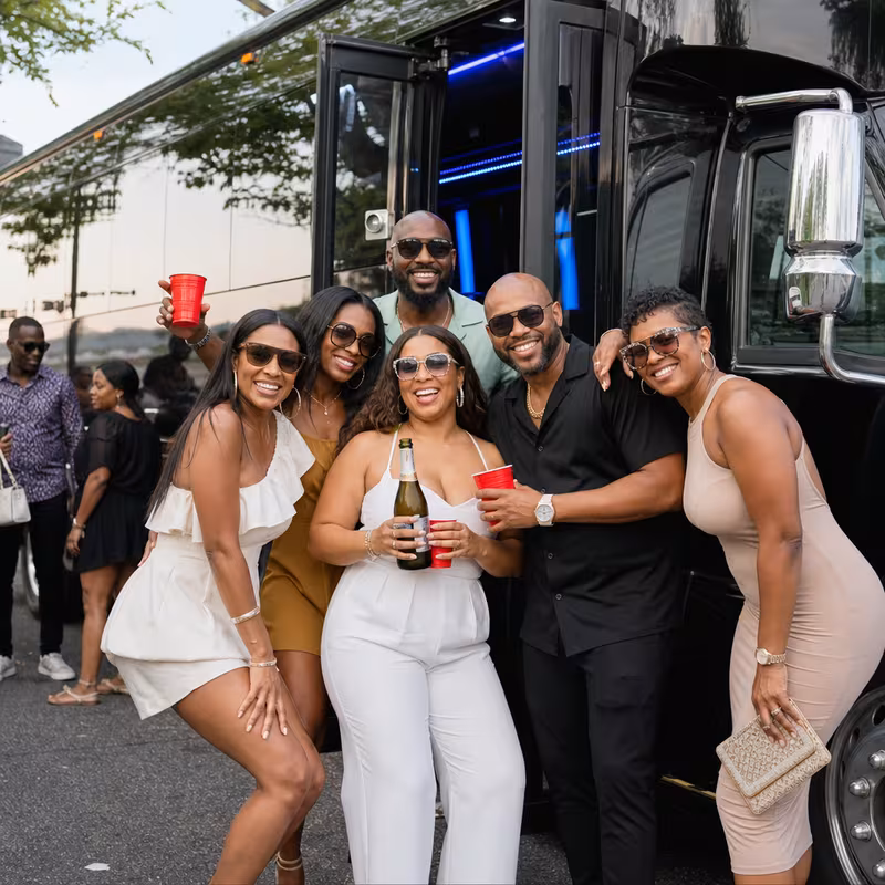 Party bus interior with wraparound leather seating and LED lighting in Frederick