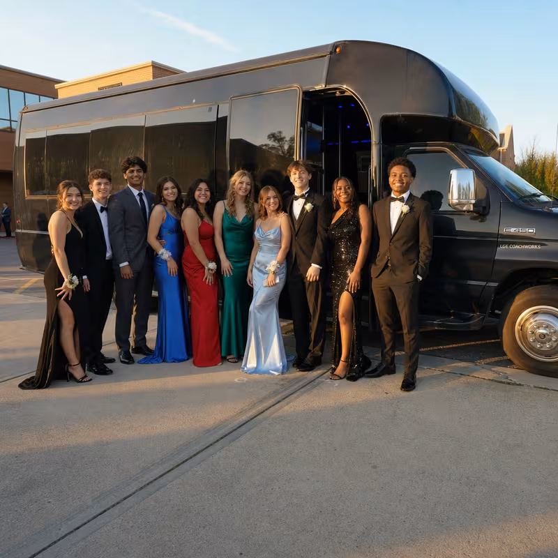 Group boarding a white charter bus for Prom & Homecoming Transportation transportation in Frederick