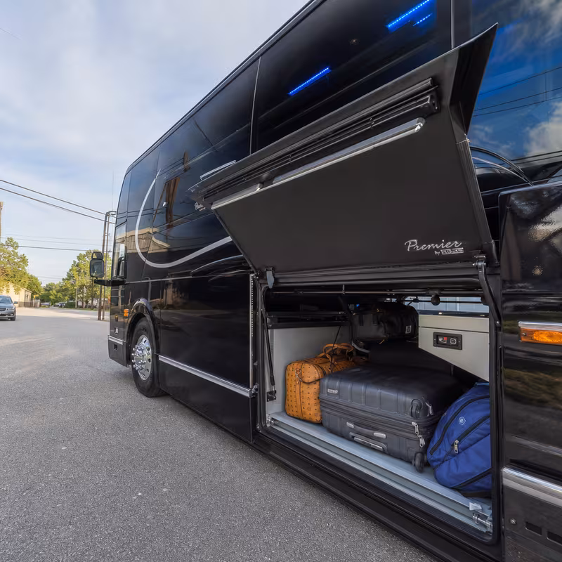 Party bus interior with wraparound leather seating and LED lighting in Frederick