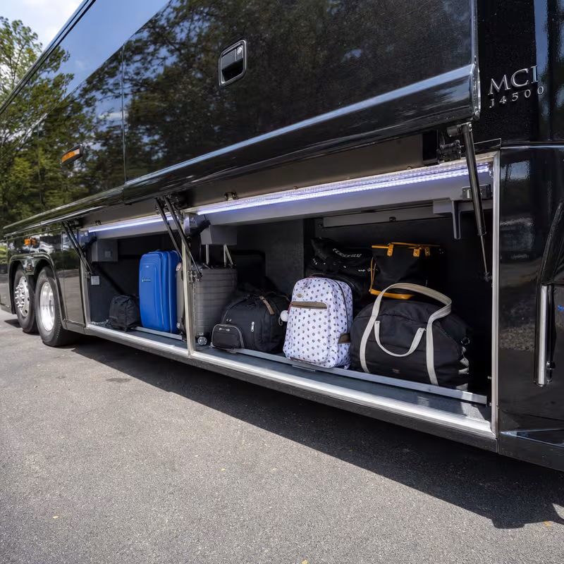 Party bus interior with wraparound leather seating and LED lighting in Frederick