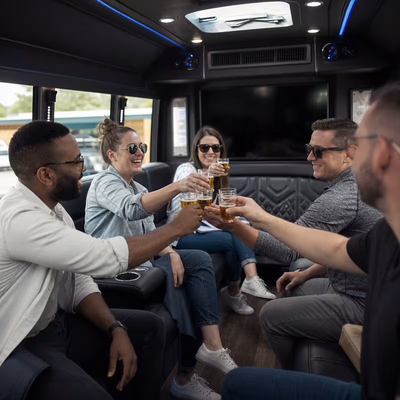 Group boarding a white charter bus for Winery & Brewery Tour Transportation transportation in Frederick